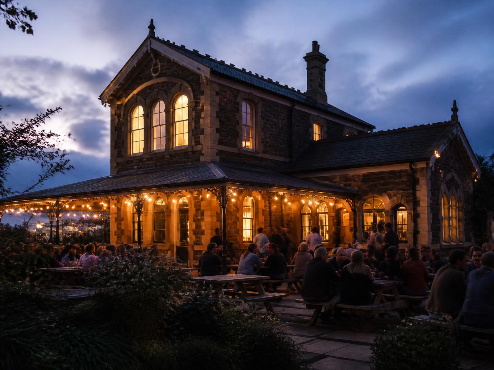 Steam Clifton's covered heated terrace at Clifton Down Station at dusk